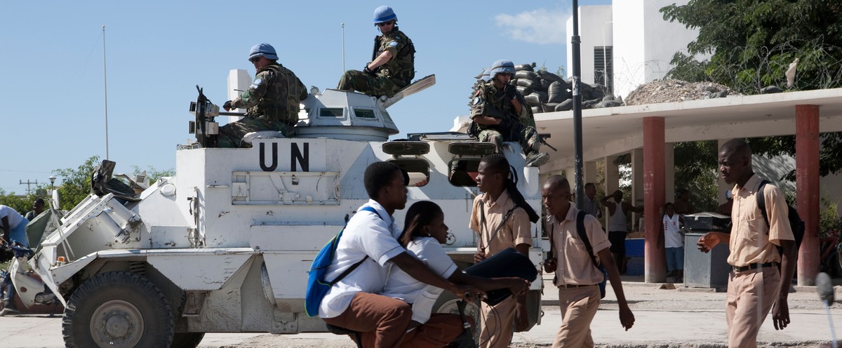 UN-vehicle with soldiers in an African village.