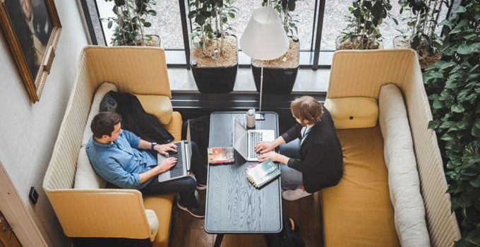 People working on computers in a library